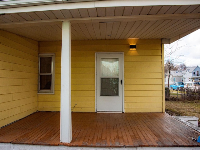 view of exterior entry featuring fence