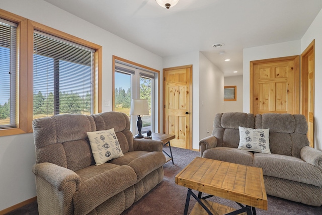 living room featuring recessed lighting, carpet flooring, and baseboards