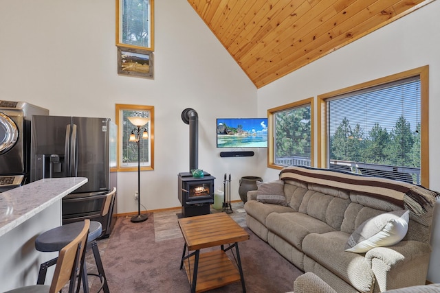 6152 Winding River Way, Fruitland, WA 99129 - carpeted living room with a wood stove, high vaulted ceiling, and wood ceiling