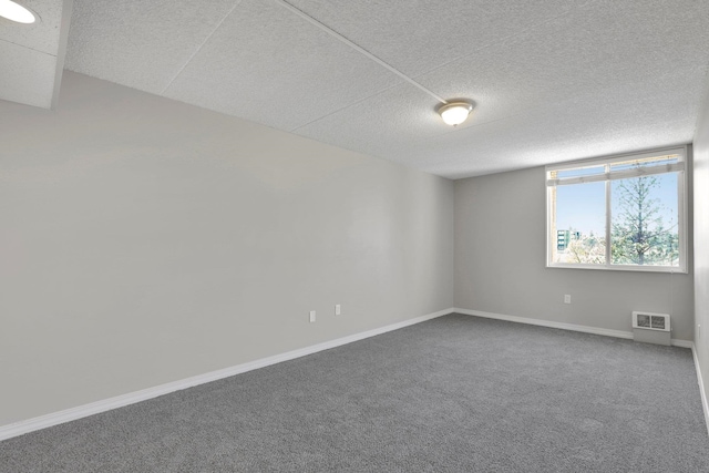 1311 S Westcliff Pl Unit 509, Spokane, WA 99224 - unfurnished room featuring carpet, baseboards, and a textured ceiling