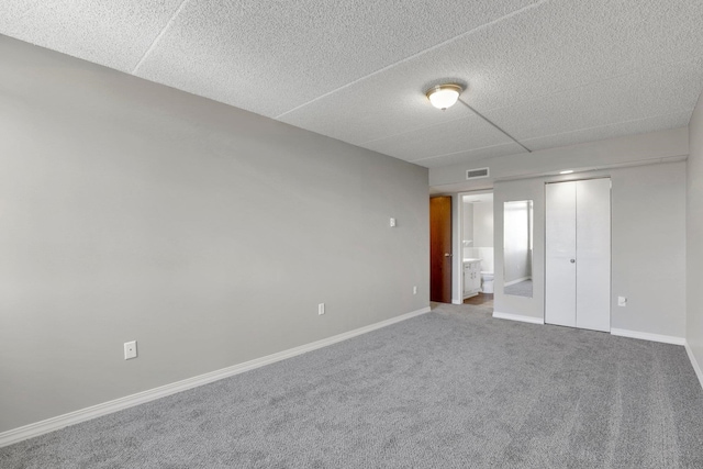 1311 S Westcliff Pl Unit 509, Spokane, WA 99224 - unfurnished bedroom with a closet, carpet floors, baseboards, and ensuite bathroom