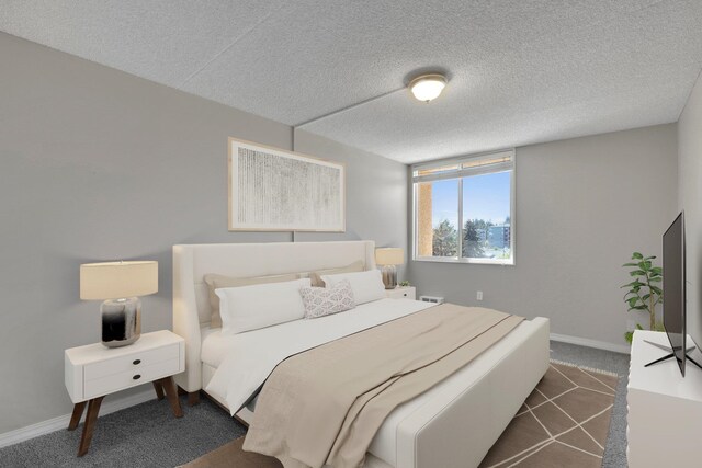 1311 S Westcliff Pl Unit 509, Spokane, WA 99224 - bedroom featuring dark carpet, baseboards, and a textured ceiling