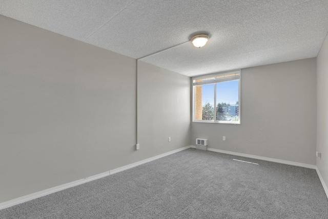 1311 S Westcliff Pl Unit 509, Spokane, WA 99224 - spare room with a textured ceiling, carpet, and baseboards