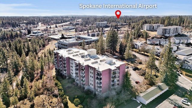 drone / aerial view featuring a view of trees