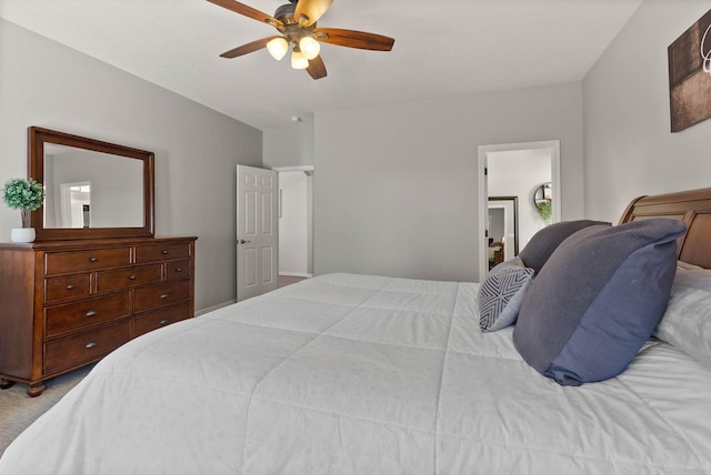 bedroom featuring a ceiling fan and light colored carpet