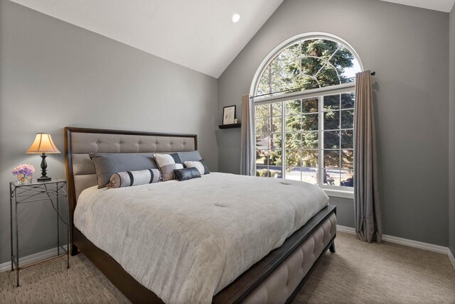 bedroom featuring carpet floors, high vaulted ceiling, and baseboards