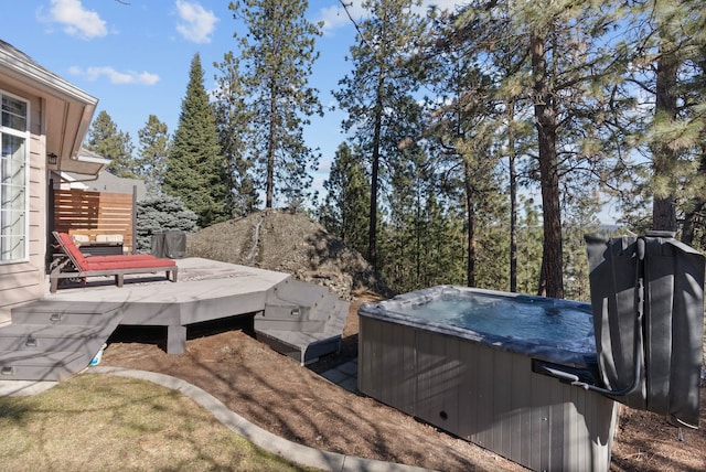 view of yard featuring a deck and a hot tub