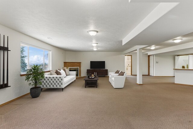 unfurnished living room with a fireplace, light colored carpet, and baseboards