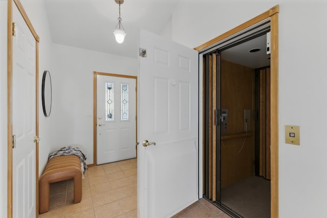 entrance foyer featuring light tile patterned floors