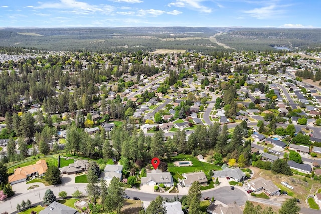 birds eye view of property with a residential view