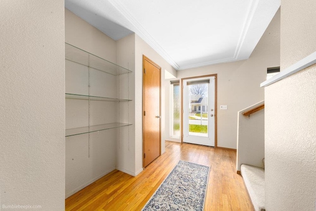 510 N Bell St, Spokane Valley, WA 99016 - doorway with baseboards, wood finished floors, and crown molding