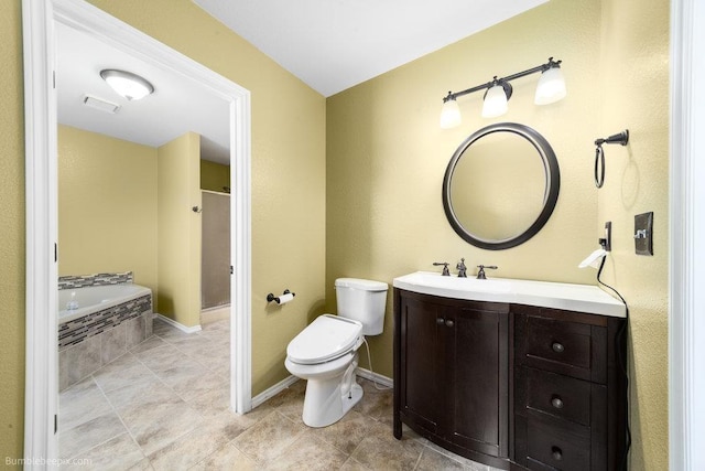 510 N Bell St, Spokane Valley, WA 99016 - bathroom featuring tile patterned floors, a bath, vanity, toilet, and visible vents