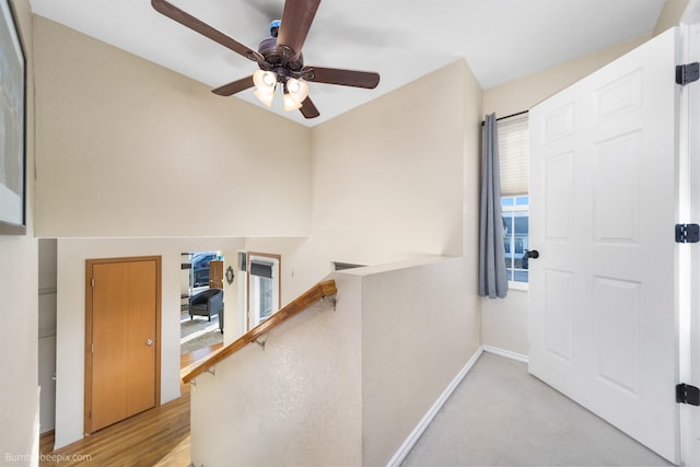 foyer featuring a ceiling fan and baseboards