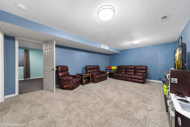 living area with baseboards, visible vents, a textured wall, a textured ceiling, and carpet floors