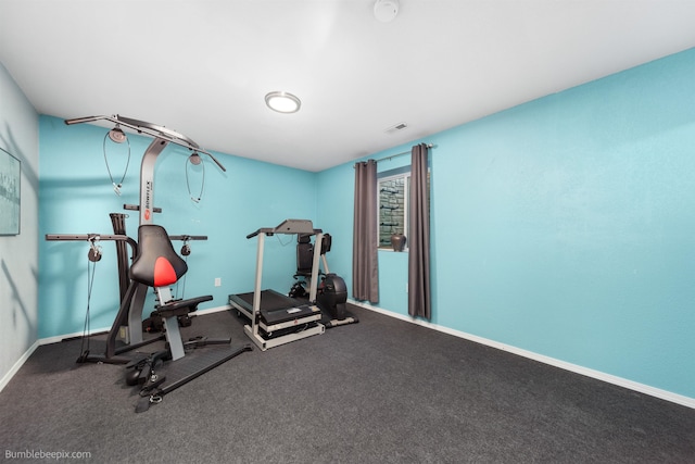 exercise room featuring visible vents and baseboards