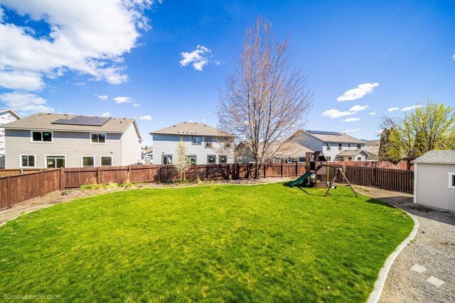 510 N Bell St, Spokane Valley, WA 99016 - view of yard with a fenced backyard, a residential view, and a playground