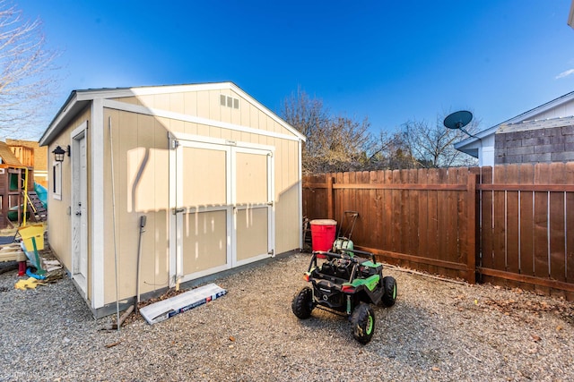 view of shed featuring a fenced backyard