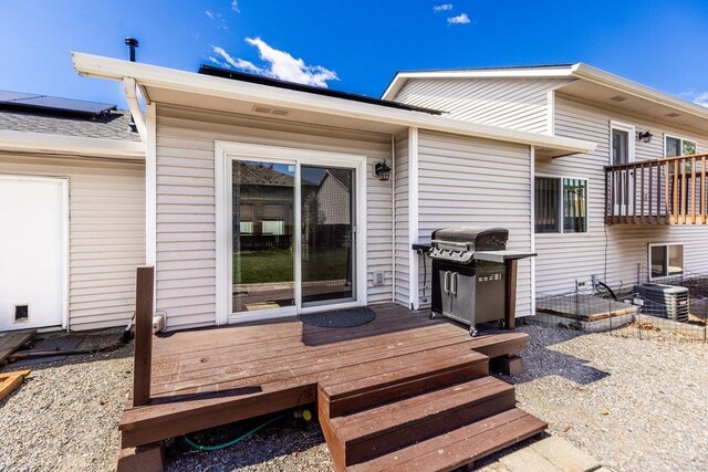 510 N Bell St, Spokane Valley, WA 99016 - rear view of property with central air condition unit and a wooden deck