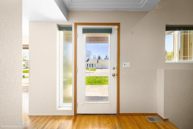510 N Bell St, Spokane Valley, WA 99016 - doorway to outside featuring visible vents, baseboards, and wood finished floors