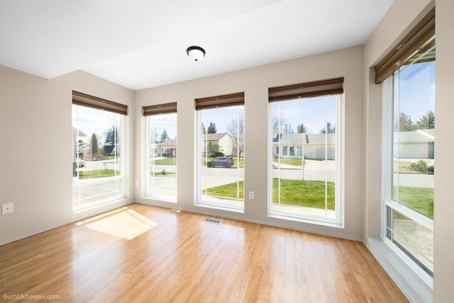 510 N Bell St, Spokane Valley, WA 99016 - interior space with wood finished floors, visible vents, and a healthy amount of sunlight