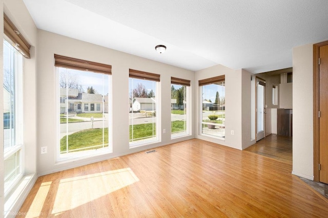 510 N Bell St, Spokane Valley, WA 99016 - interior space featuring baseboards, a healthy amount of sunlight, visible vents, and light wood-style flooring