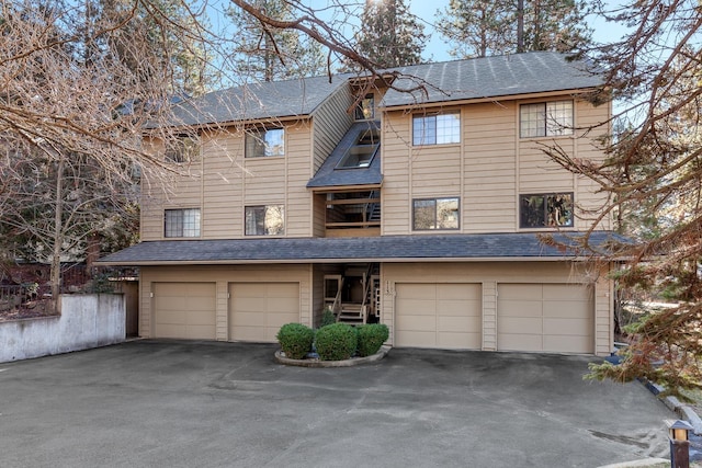 view of front of home with an attached garage and driveway