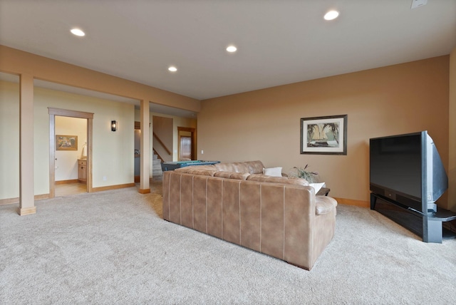 living room featuring recessed lighting, light carpet, stairway, and baseboards