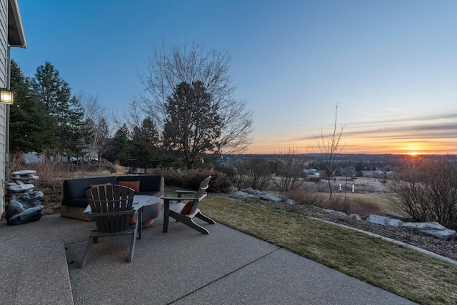 view of patio terrace at dusk