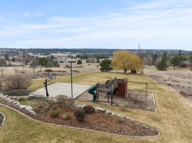 exterior space with a playground and a rural view