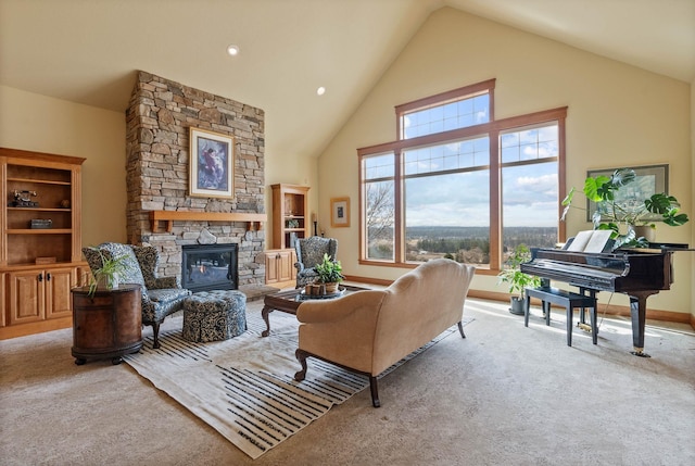 carpeted living area with high vaulted ceiling, a stone fireplace, and baseboards