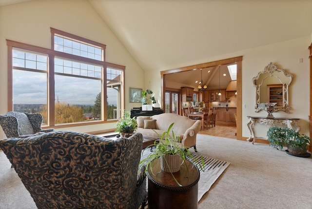 living room featuring light carpet and high vaulted ceiling