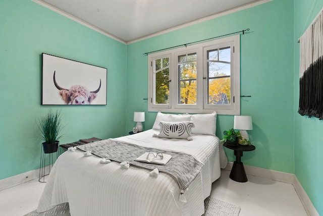 bedroom with concrete flooring, ornamental molding, and baseboards