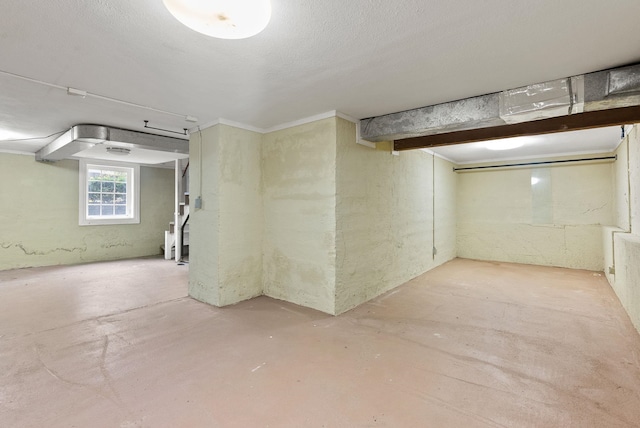 basement featuring a textured ceiling