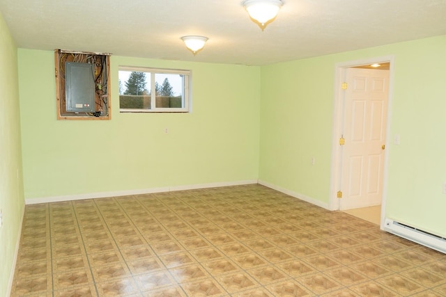 unfurnished room with a baseboard radiator, electric panel, and baseboards