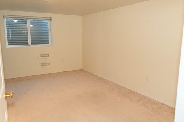 spare room with carpet flooring