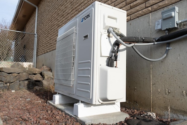 view of side of property with ac unit