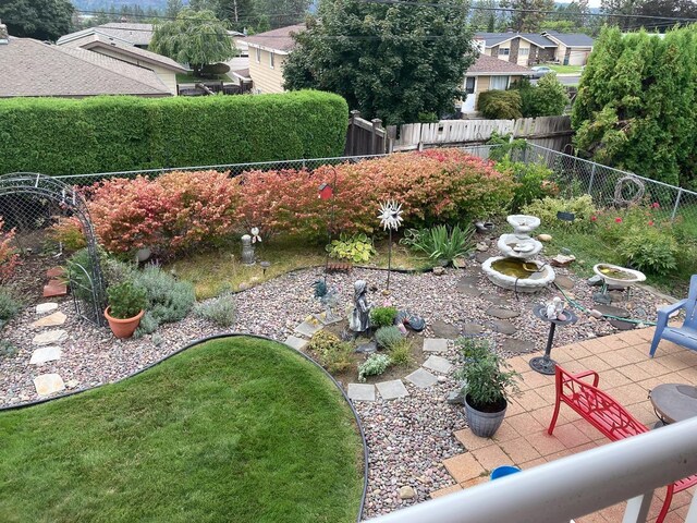 view of yard with a fenced backyard and a patio