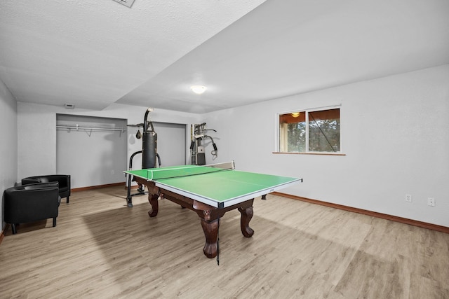 game room featuring wood finished floors and baseboards