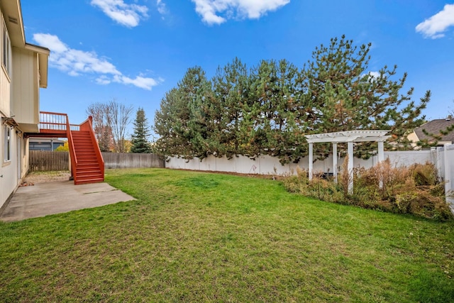 view of yard with stairs, a patio, a fenced backyard, and a pergola