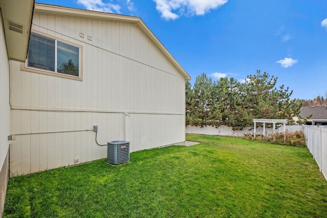 exterior space with central AC, a fenced backyard, and a pergola