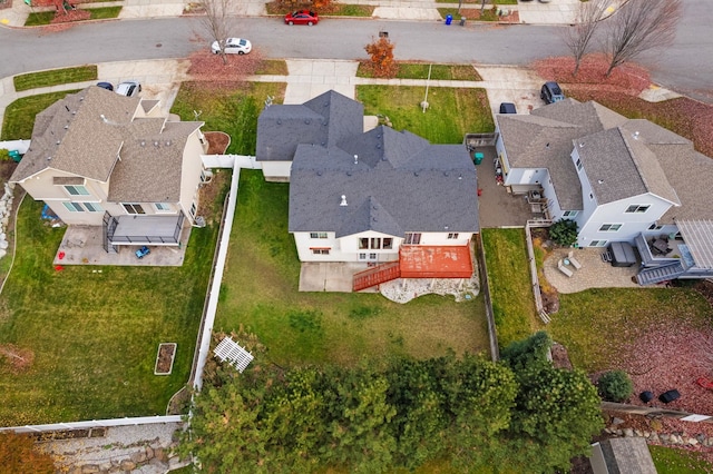 birds eye view of property with a residential view