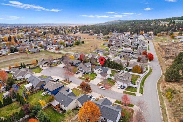 birds eye view of property with a residential view