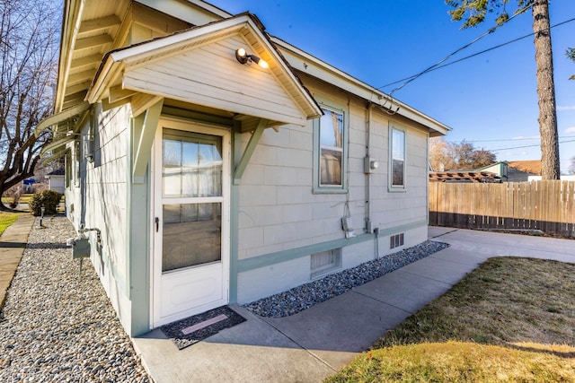 view of home's exterior featuring fence