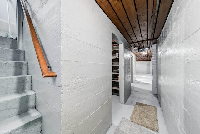 interior space with concrete flooring and wood ceiling
