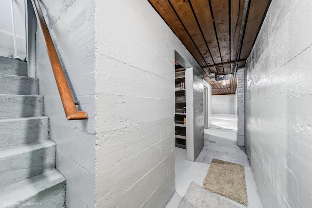 interior space featuring concrete floors and wooden ceiling