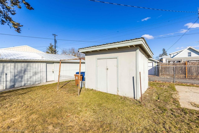 view of shed with fence