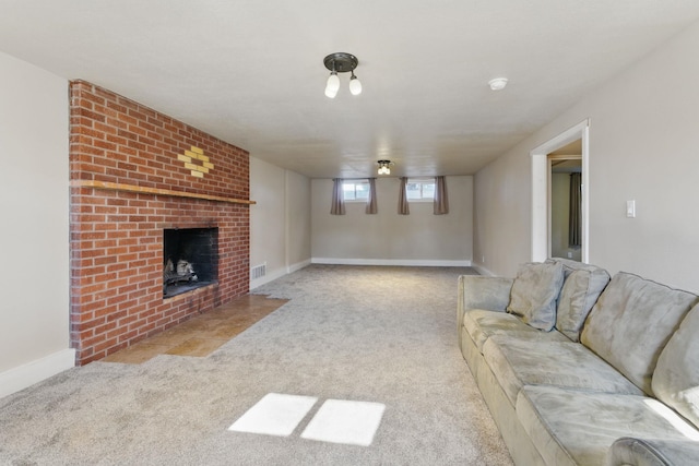 living area featuring carpet, a fireplace, baseboards, and visible vents