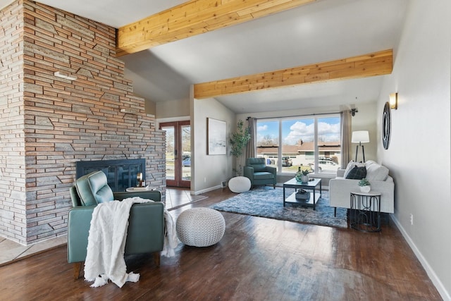 living room with baseboards, a wealth of natural light, and wood finished floors