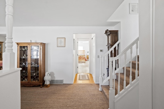 interior space featuring carpet flooring and visible vents