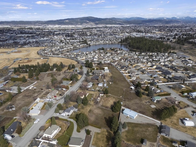 bird's eye view featuring a water and mountain view